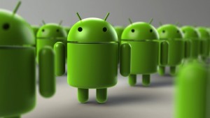 A group of green Android robot figurines are positioned in rows, with the primary focus on the figure in the center of the frame.